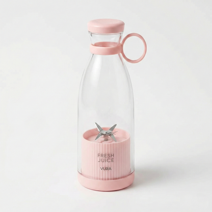 Pink and clear blender with 'Fresh Juice' text on a white background